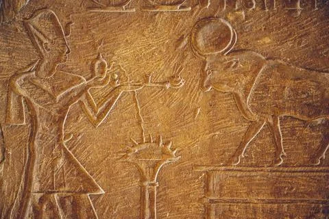 CAIRO, EGYPT - Jun 06, 2021: An ancient Egyptian stone surface with carvings  Stock Photos