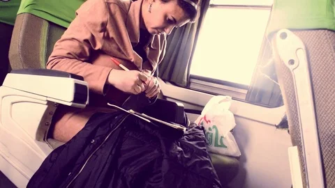 CAIRO, EGYPT - Mar 04, 2017: Egyptian female busy on the train Stock Footage 87910447