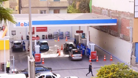 CAIRO, EGYPT - Mar 11, 2018:  Egyptian streets and gas station in the rush hour Stock Footage 87910387