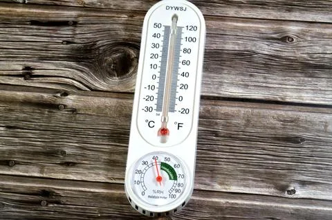 Cairo, Egypt, May 15 2026: a classic analog vertical thermometer, displayin.. Stock Photos