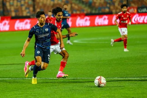   CAIRO, EGYPT - MAY 29: Ahmed Hani of Ceramica (2) and Al Ahly defenders ... Stock Photos