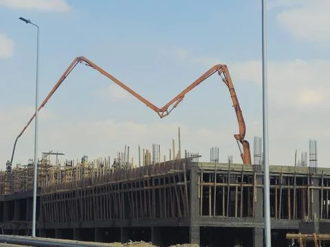 Cairo, Egypt, May 4 2026: a truck-mounted concrete boom pump at a construct.. Stock Photos