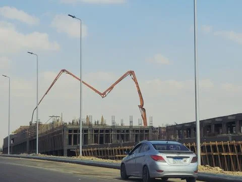 Cairo, Egypt, May 4 2026: a truck-mounted concrete boom pump at a construct.. Stock Photos