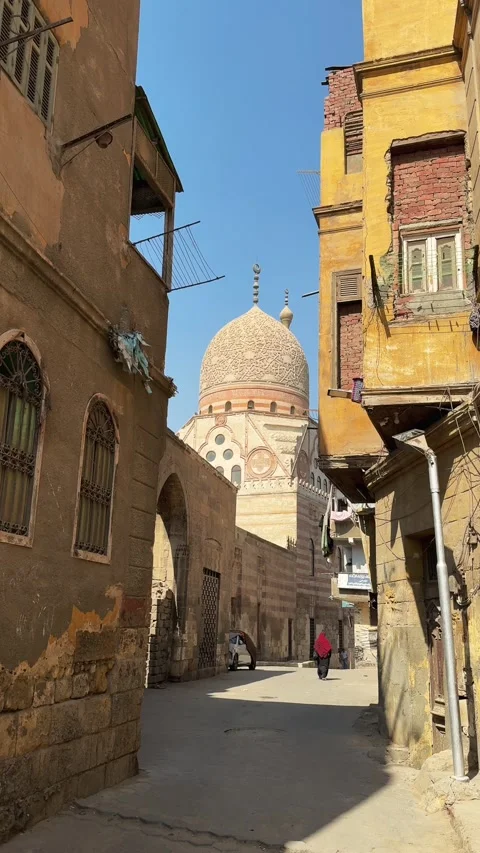Cairo, Egypt - November 11, 2025: Mosque dome between aging residential Stock Footage 340942212