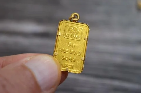 Cairo, Egypt, October 29 2025: A PAMP Suisse gold bar pendant, 24K Gold Bar.. Stock Photos