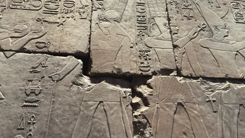 Cairo, Egypt - October 30, 2025: Close up of carved cracked stone wall relief Video stock 341452259