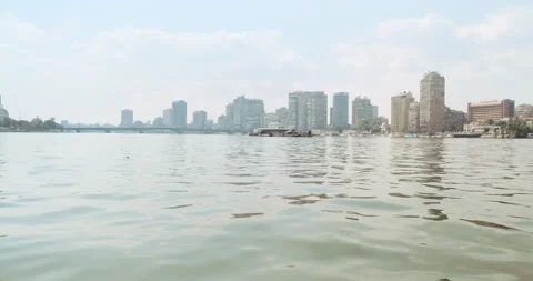 Cairo Egypt view of Nile river on sunny day. Panorama of city from floating boat Stock Footage 152644450