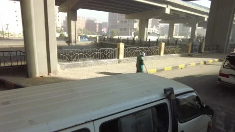 In Cairo, a man sweeps the street Stock Footage 210765354