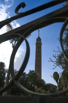 Cairo Tower seen through decorative metalwork, capturing a quiet moment Stock Photos