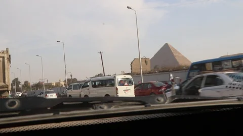 Cairo traffic and the Great pyramid Stock Footage 96384943