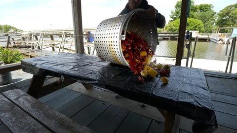 Cajun Crawfish Boil Dumped On Table Stock Footage
