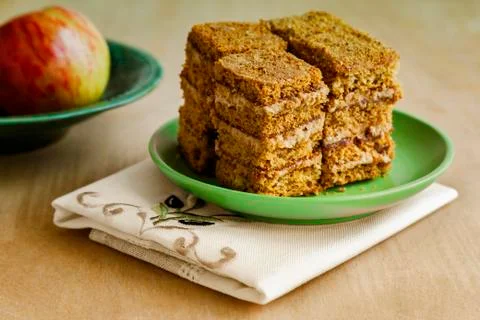 Cake and Apple on the table on a plate. Stock Photos
