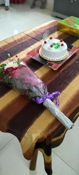 Cake and bouquet Stock Photos