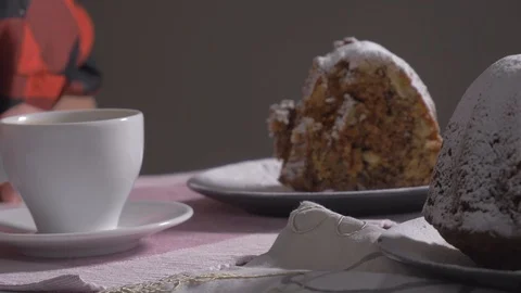 Cake and cup of coffee on kitchen table,eating Stock Footage 103147198