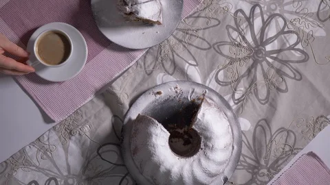 Cake and cup of coffee on kitchen table, top view. Stock Footage 103148357