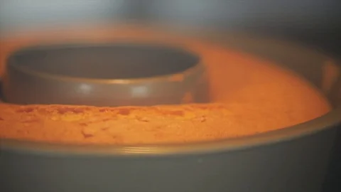 A Cake Bakes in the Oven Closeup Stock Footage 99164077
