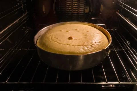 Cake baking inside of the oven Stock Photos