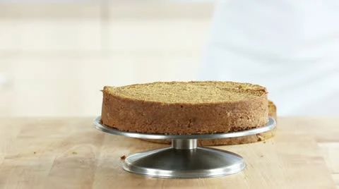 A cake base being spread with cream cheese Stock-Footage 24671683