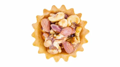 Cake in basket with nuts, rotating on white background 스톡 동영상 242358597