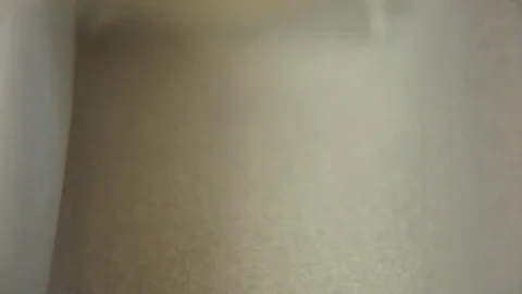 Cake batter being poured into baking container Vídeos de archivo 76099697