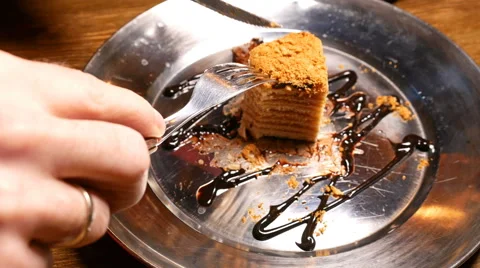 Cake being cut with fork and knife. Close up shot. Stock Footage 60260858