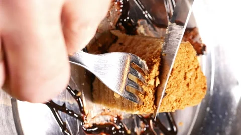 Cake being cut with fork and knife. Close up shot. Stock Footage 91163721