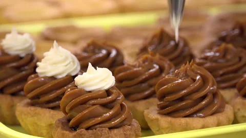 Cake being made in a pastry shop Stock Footage 239588993