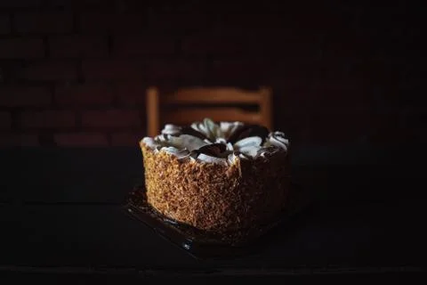 Cake on a black table on a blurry background Stock Photos