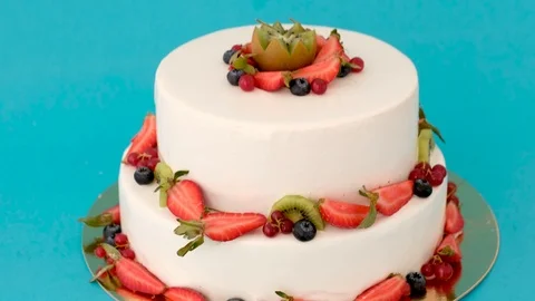 Cake on a blue background whith berries Stock Footage 126093822
