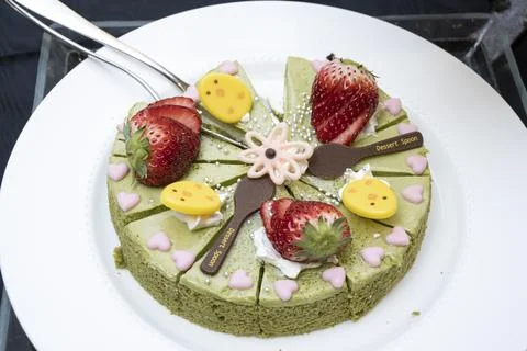 Cake buffet with various bite-sized cakes lined up Stock Photos
