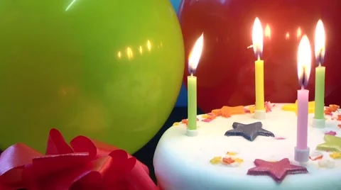 Cake candles red and green balloons Stock Footage 46979969