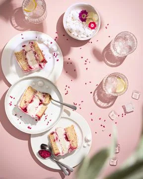 Cake with cherry and coconat on a pink background, hard light Stock Photos