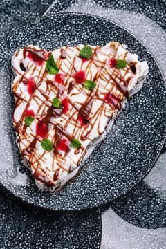 Cake with cherry jam on ceramic plate Stock Photos