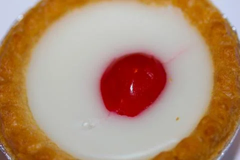 Cake with cherry on top Stock Photos