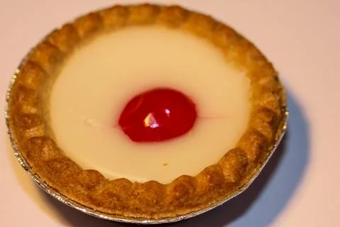 Cake with cherry on top Stock Photos