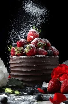 Cake with chocolate decorating with strawberry and flowers Stock Photos