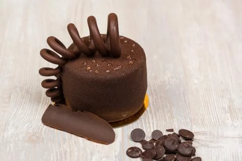 The cake with chocolate spring on the table Stock Photos