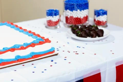 Cake with chocolates on table at party Stock Photos