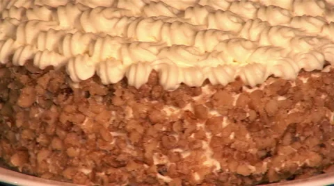Cake with cream and crushed nuts on plate, close-up Stock Footage 46525720