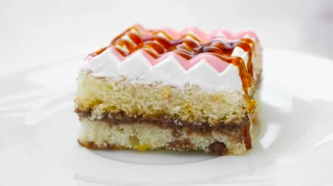 Cake with cream and different jams on top Stock Footage 54340853
