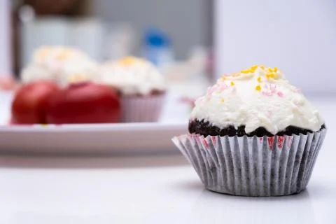 Cake. Cup cake on white table, on white background. Stock Photos
