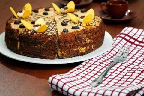 Cake with a cup of coffee on the table Stock Photos