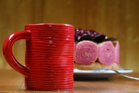 Cake with a cup of coffee on the table Stock Photos