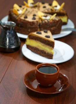 Cake with a cup of coffee on the table Stock Photos