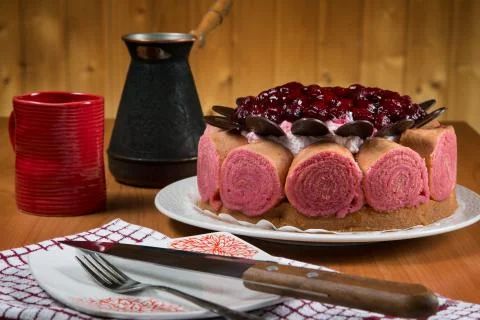 Cake with a cup of coffee on the table Stock Photos