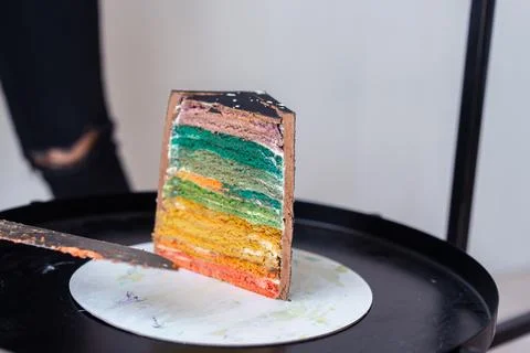 Cake Cut with Colored Layers and Knife Stock Photos