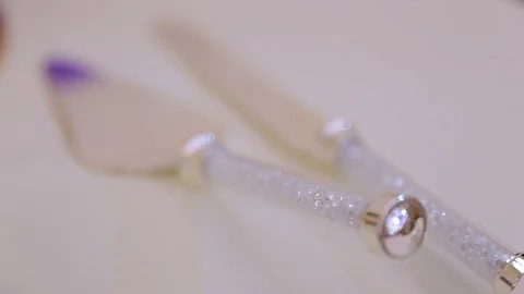 Cake Cutting Knife and Fork. Wedding cake table with knife and fork on a table Stock Footage 76346273