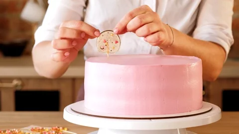 Cake decor workshop pastry chef add lollipops cake Stock Footage 112220282