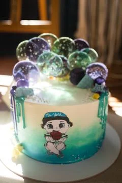 Cake decorated with balls from candy. Stock Photos