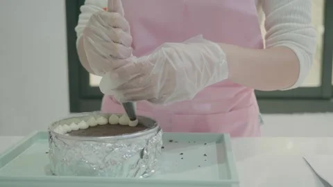 Cake Decorating Process in a Modern Kitchen Stock Footage 314455937